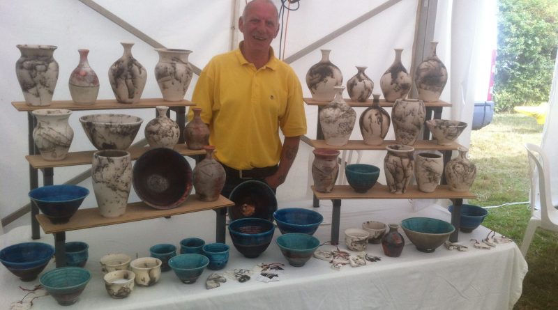 Ben Mcmanigan with a selection of his horse hair pottery